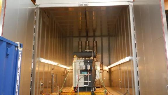 Entrance to the large climatic test chamber with a Siemens transformer positioned inside for testing