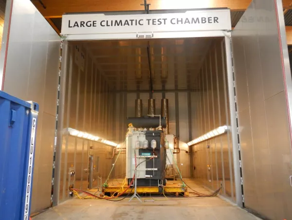 Entrance to the large climatic test chamber with a Siemens transformer positioned inside for testing
