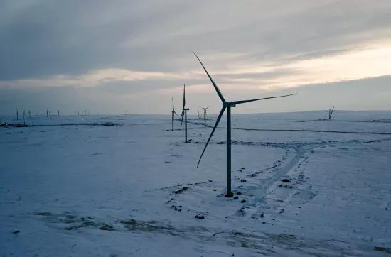 Wind turbines in cold snowy landscape