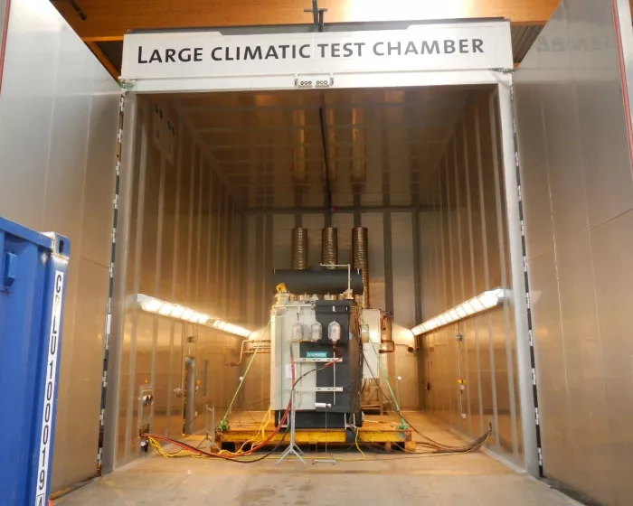 Entrance to the large climatic test chamber with a Siemens transformer positioned inside for testing